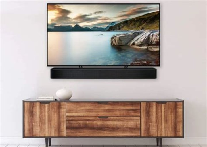 Can a sound bar be placed on a TV stand?