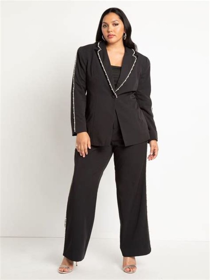 Can a woman wear a black pant suit to a wedding?