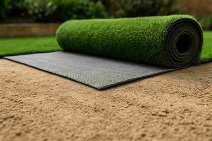 Can you put sand on top of artificial grass?