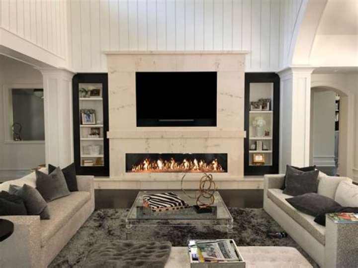 Can you sit a TV on top of a fireplace?