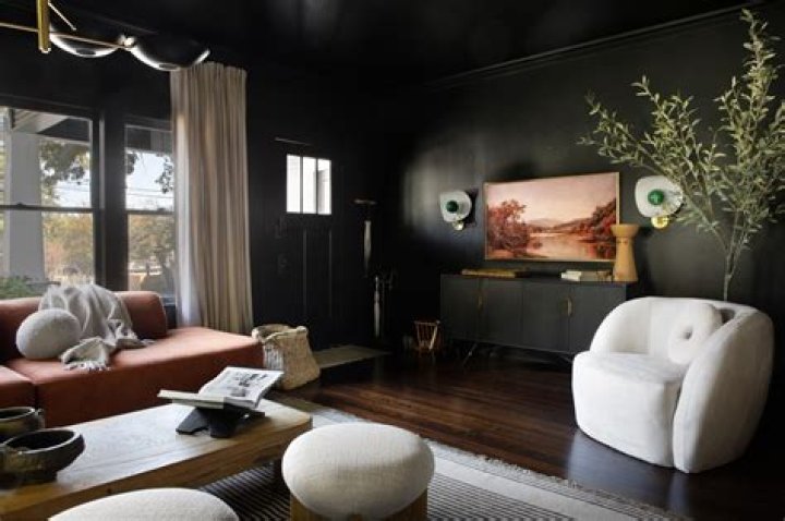 Does dark paint make a room darker?