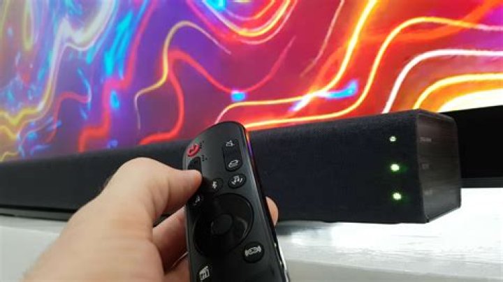 How do I program my remote to my sound bar?