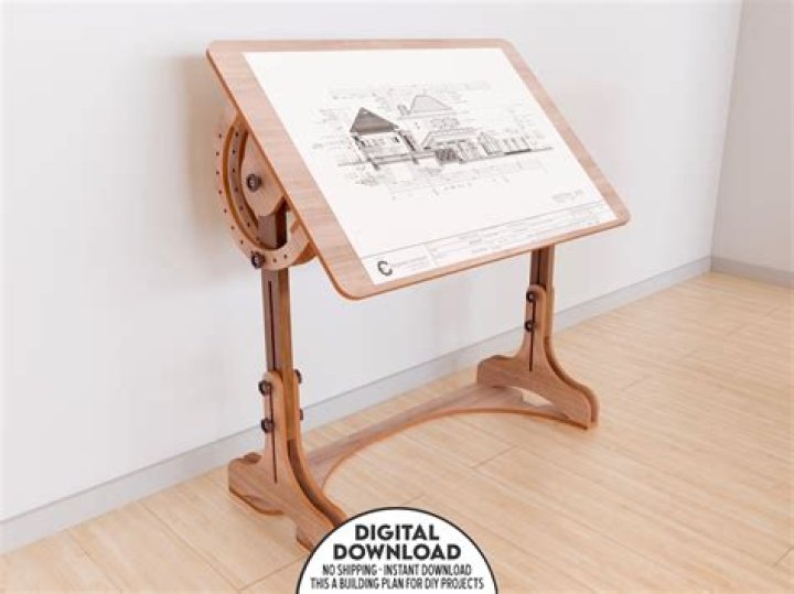 How do you adjust the height of a drafting table?