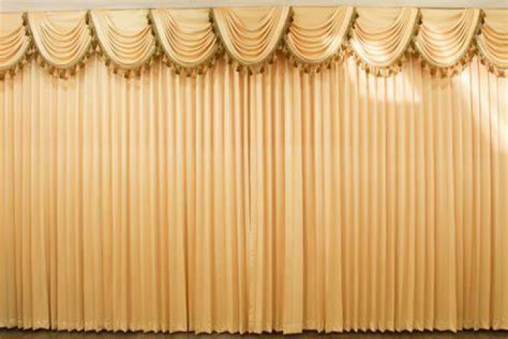 How do you clean stage curtains?