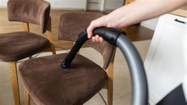 How do you clean upholstered chairs?