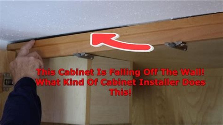 How do you fix a cabinet that pulls away from a wall?