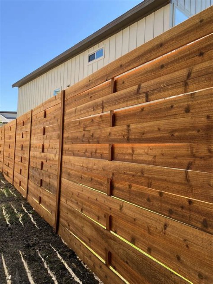How do you freshen a cedar fence?