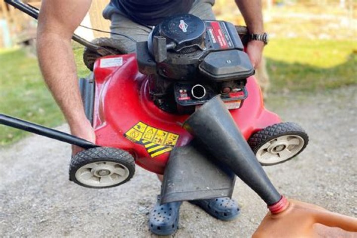 How do you get gas out of a push lawn mower?
