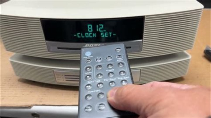 How do you reset the time on a Bose Wave?