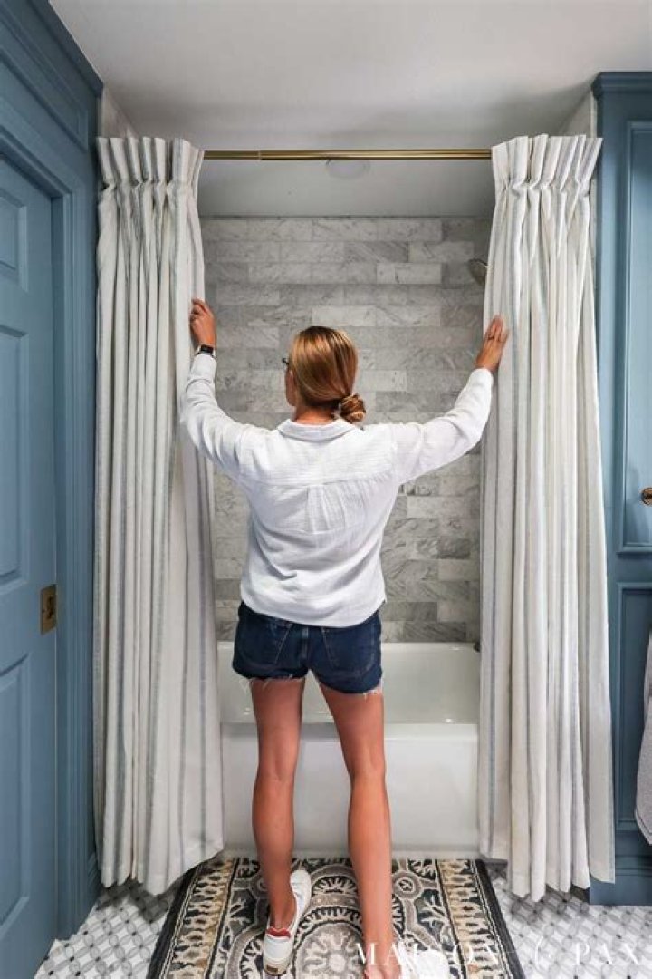 How high should a shower curtain be from the ceiling?