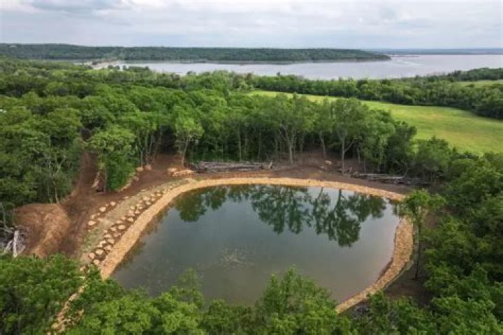 How long does it take to dig a 1/2 acre pond?