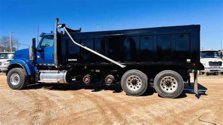 How much can a quad axle dump truck haul?