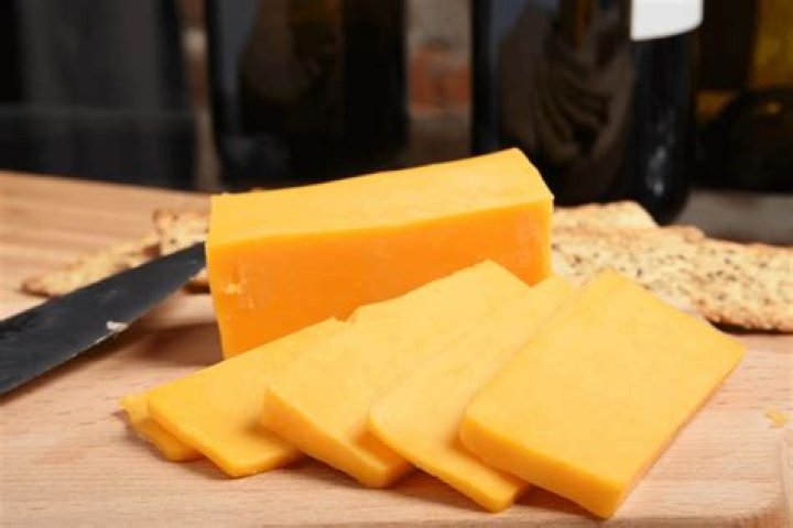 How was cheddar cheese made?
