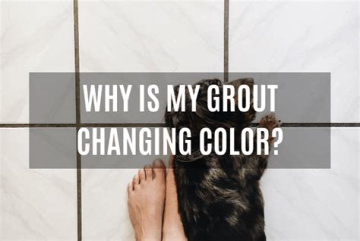 What causes grout to change color?