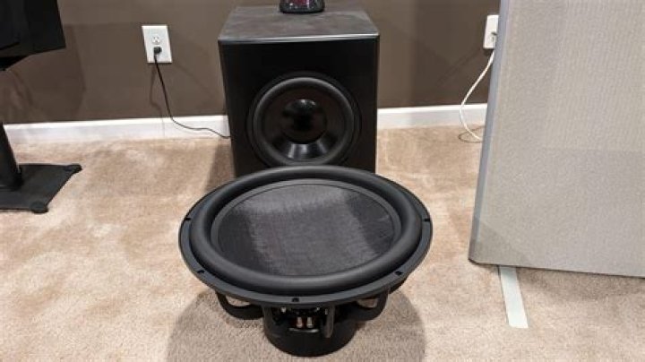 What causes hum in subwoofer?