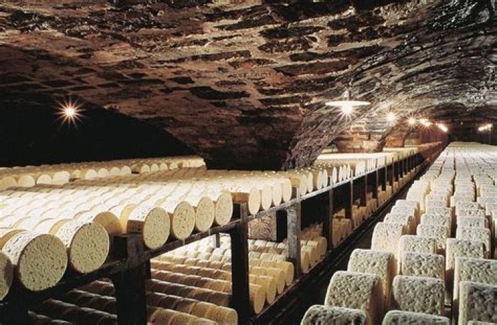 What cheese is aged in caves in France?