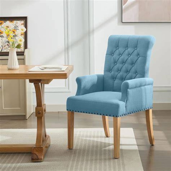 What do you call dining chairs with arms?