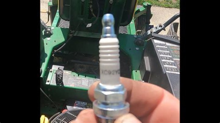 What Spark Plug does a John Deere L100 take?