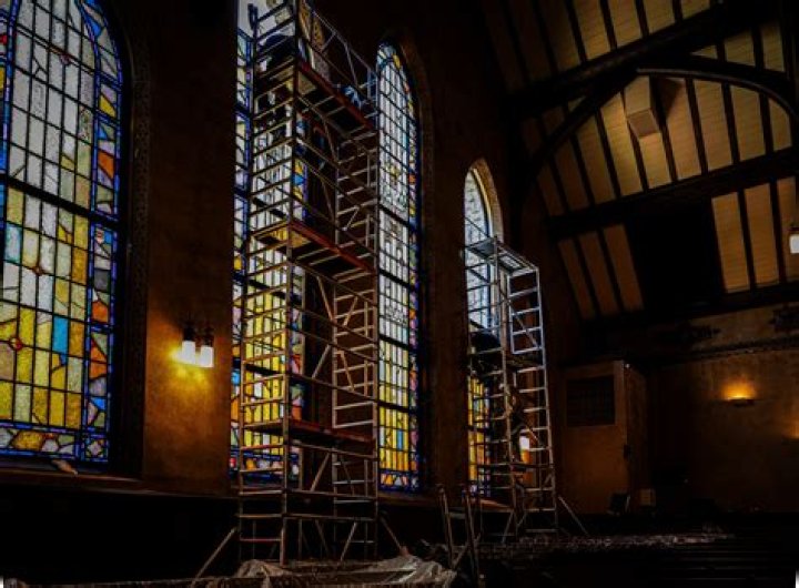 What was the first church to use stained glass?