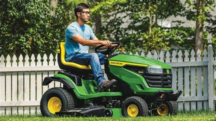 Where is the gas tank on a John Deere lawn mower?