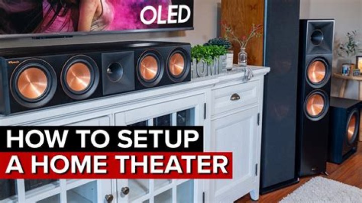 Where should the center speaker be on a home theater system?