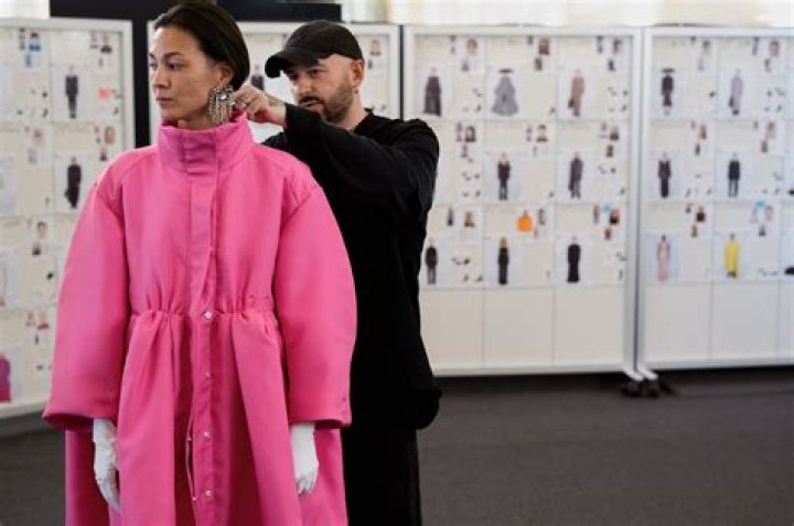 Who is the designer behind Balenciaga?