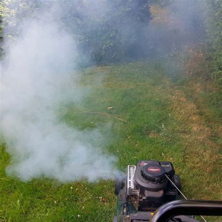 Why is my lawn mower giving off white smoke?